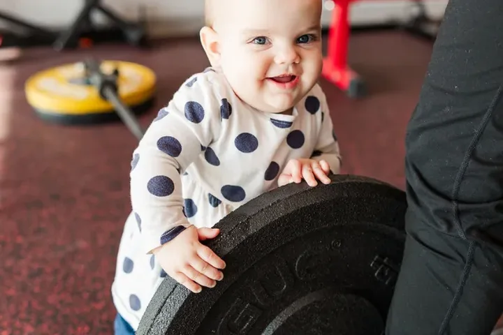A team member’s child visiting the gym floor at Kaizen Health and Wellness in Urbandale, IA