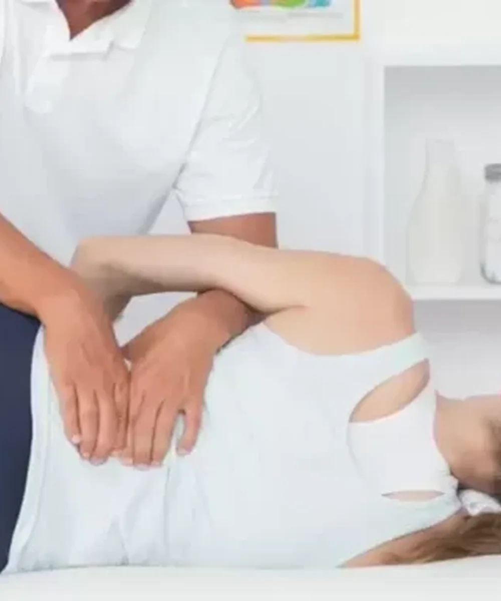 A Doctor of Physical Therapy evaluating low back pain at Kaizen Health and Wellness in Urbandale, IA