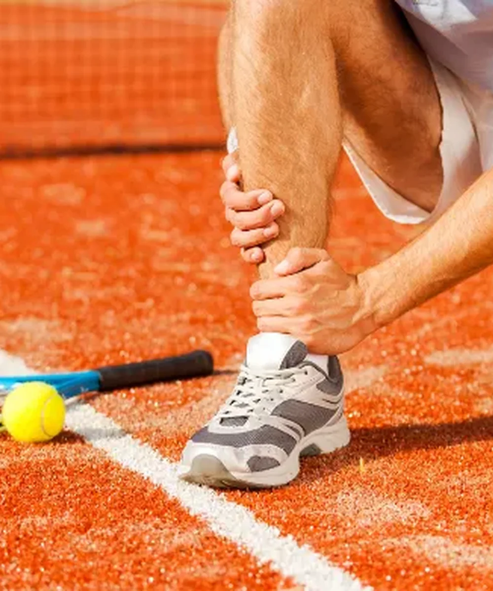 A Doctor of Physical Therapy evaluating a sports injury at Kaizen Health and Wellness in Urbandale, IA